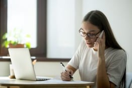 female-worker-consulting-client-phone-min-300x200